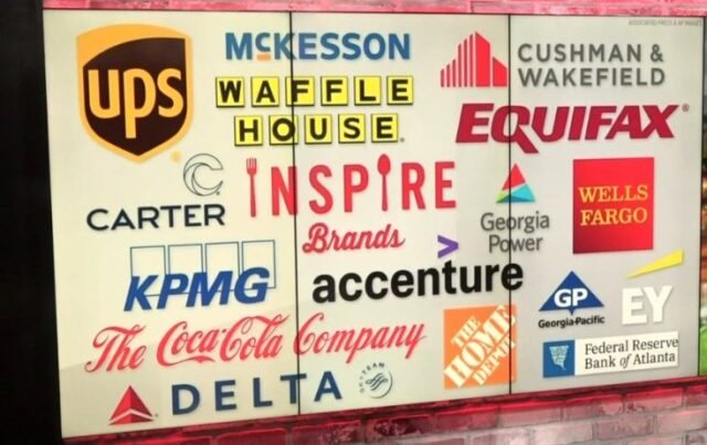 A sign that features the logos of prominent corporations funding Cop City, including Home Depot, Coca-Cola, Delta, UPS, and Waffle House. 