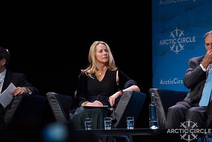 Laurene Powell Jobs sits, listening to a speaker, at Arctic Circle 2017.